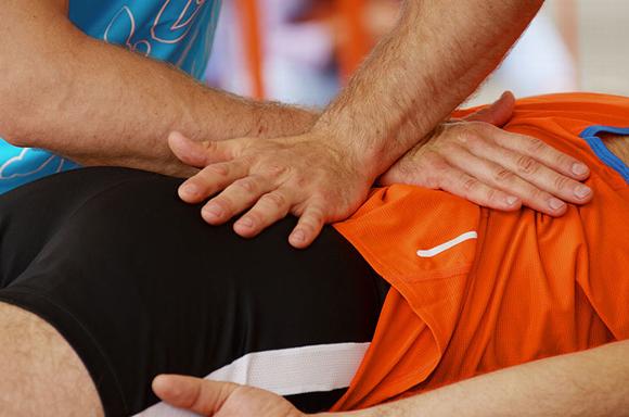 physio treating sports injury in clinic