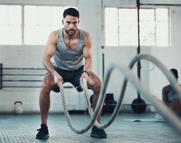 man rope training in gym